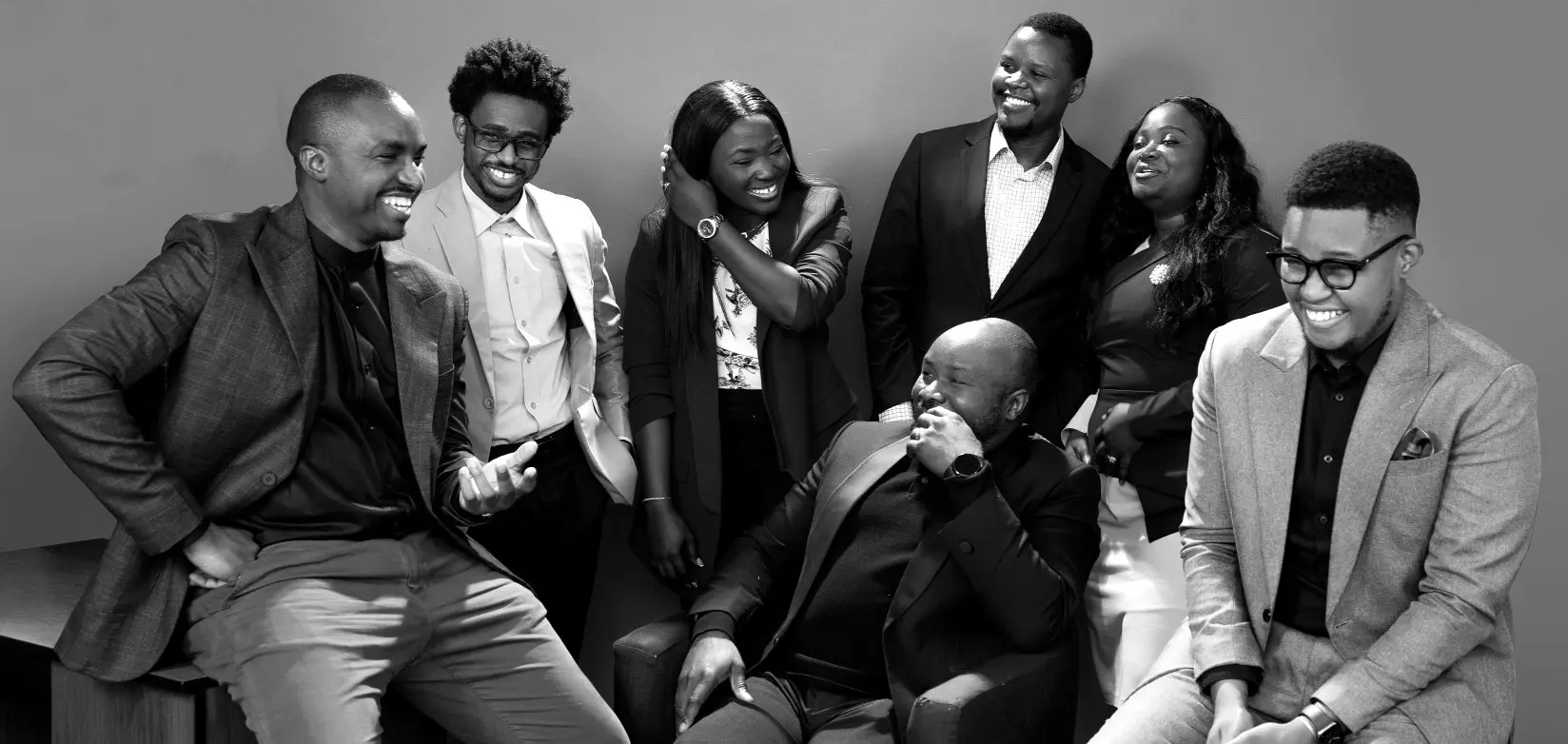 Seamfix colleagues laughing together during a team photo