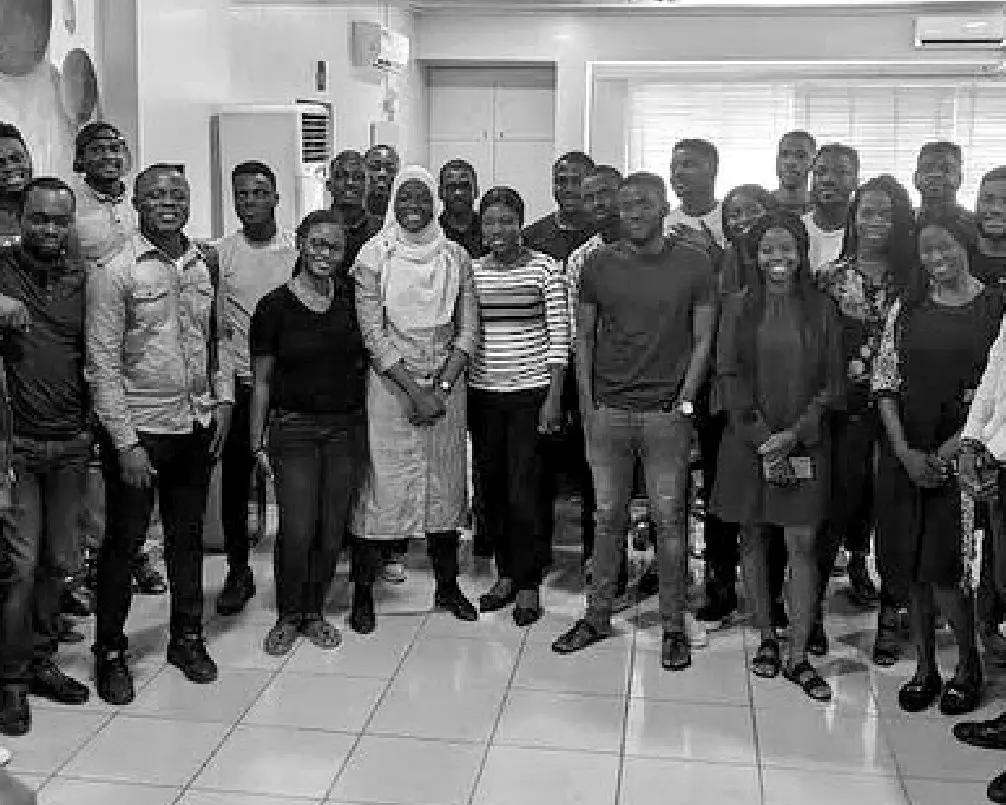 A large group of Seamfix staff gathered together in the office